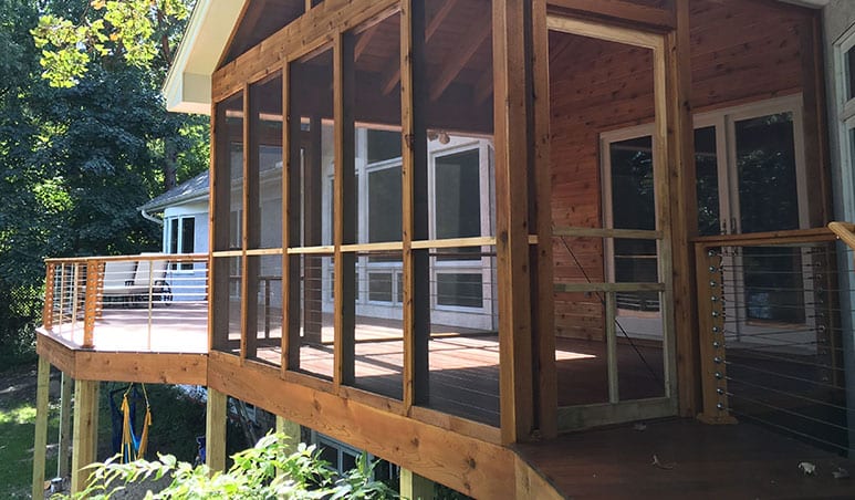 screened in porch next to new deck
