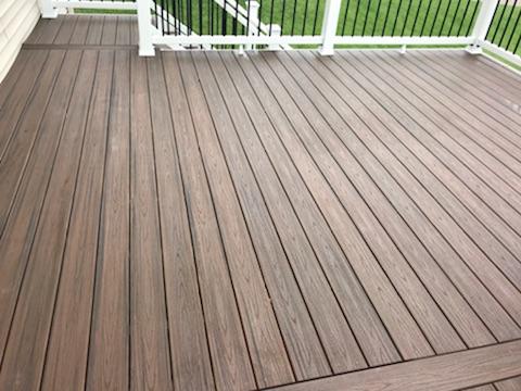 Dark colored composite deck surface
