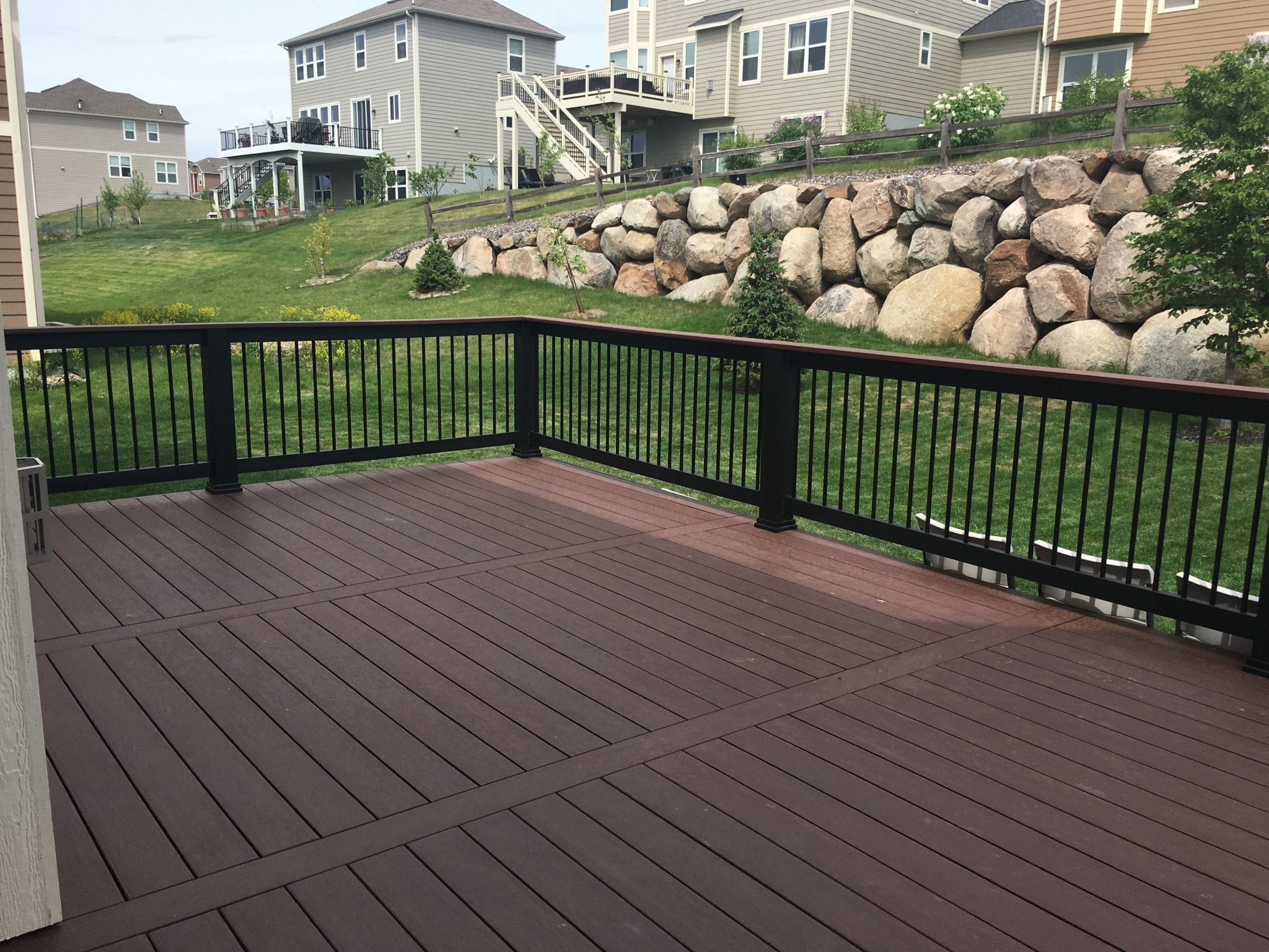 New deck with dark stain and dark railings