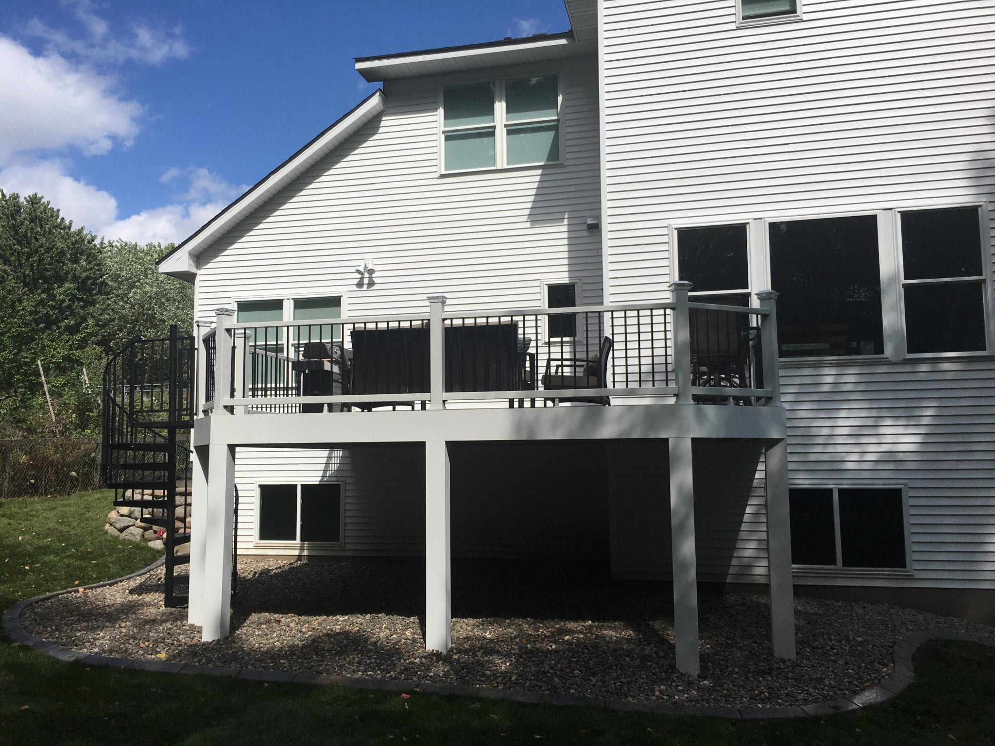 Gray raised deck with spiraling staircase