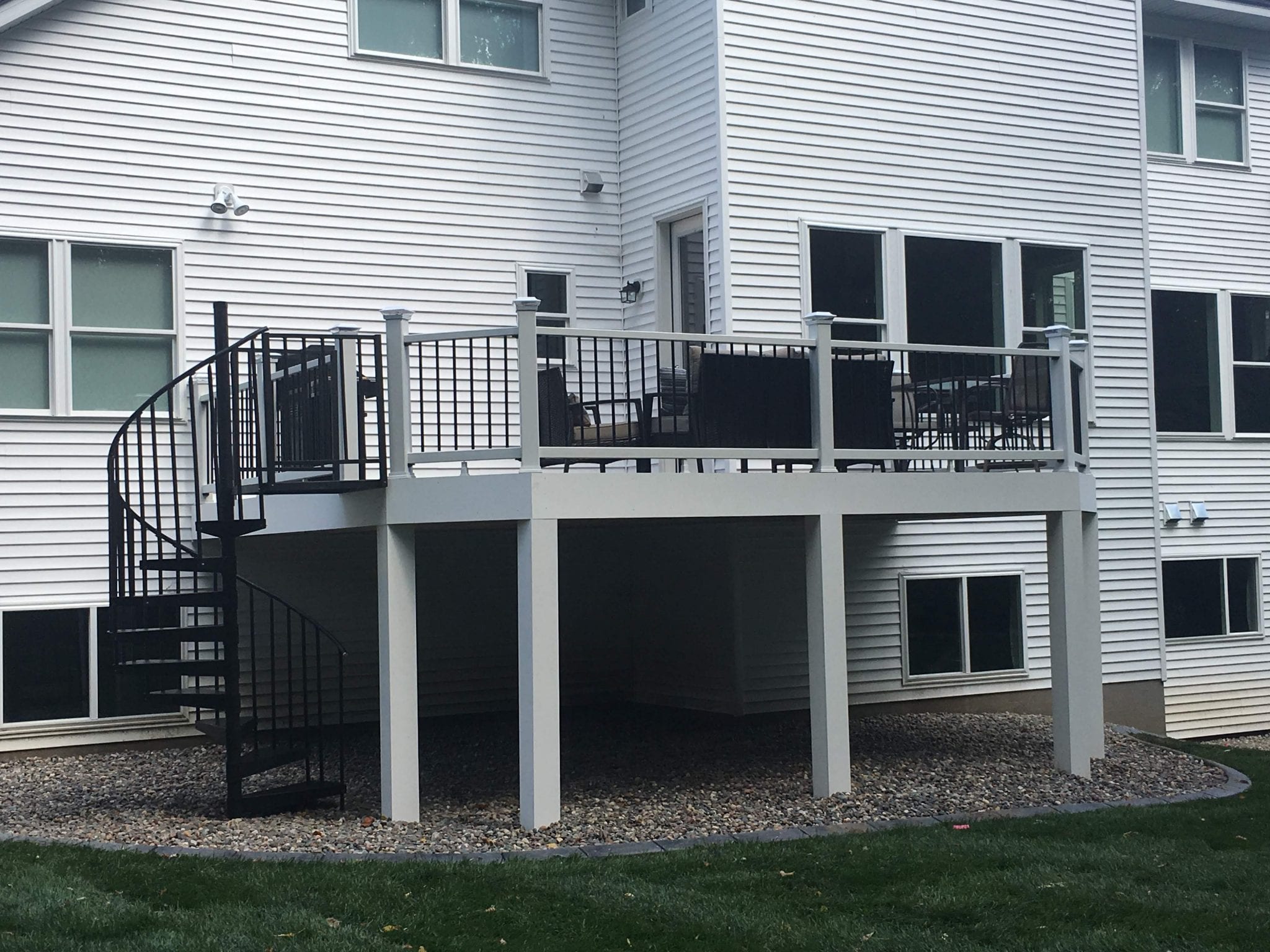 Gray raised deck with spiraling staircase