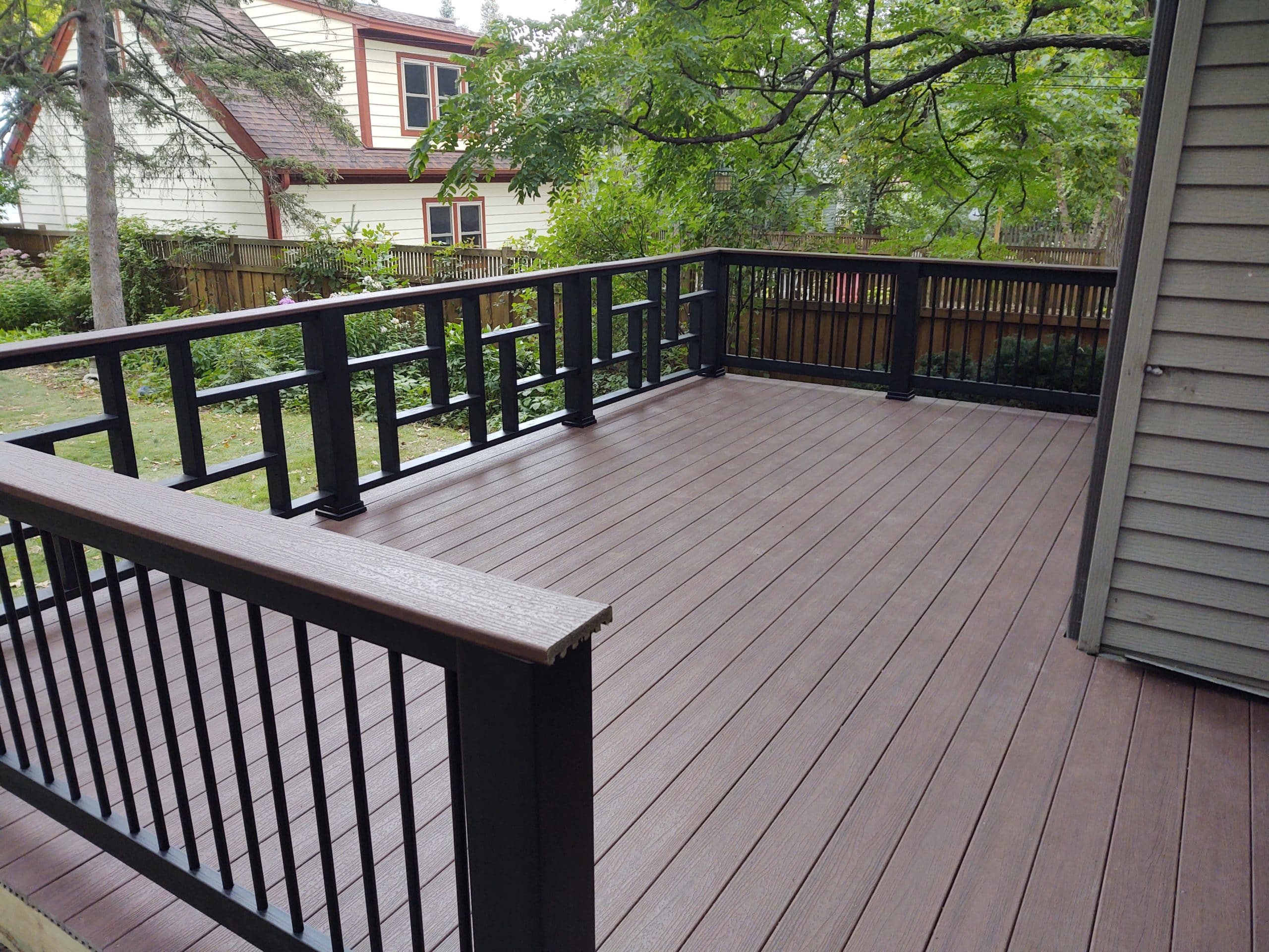 new composite deck surface with black railings