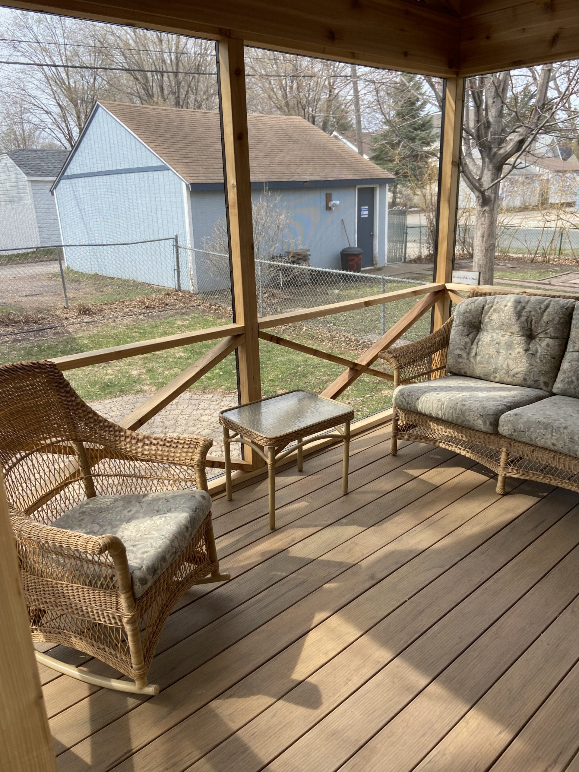 interior of an all wood screened in porch