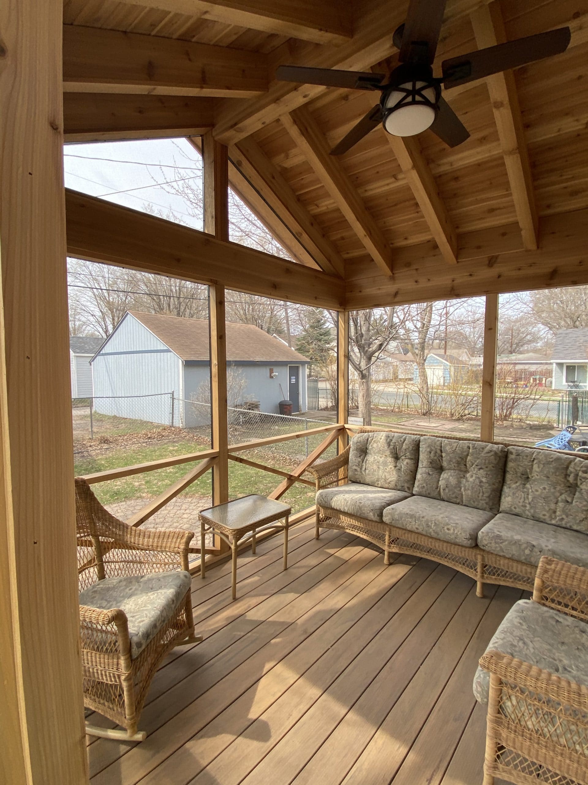 interior of an all wood screened in porch