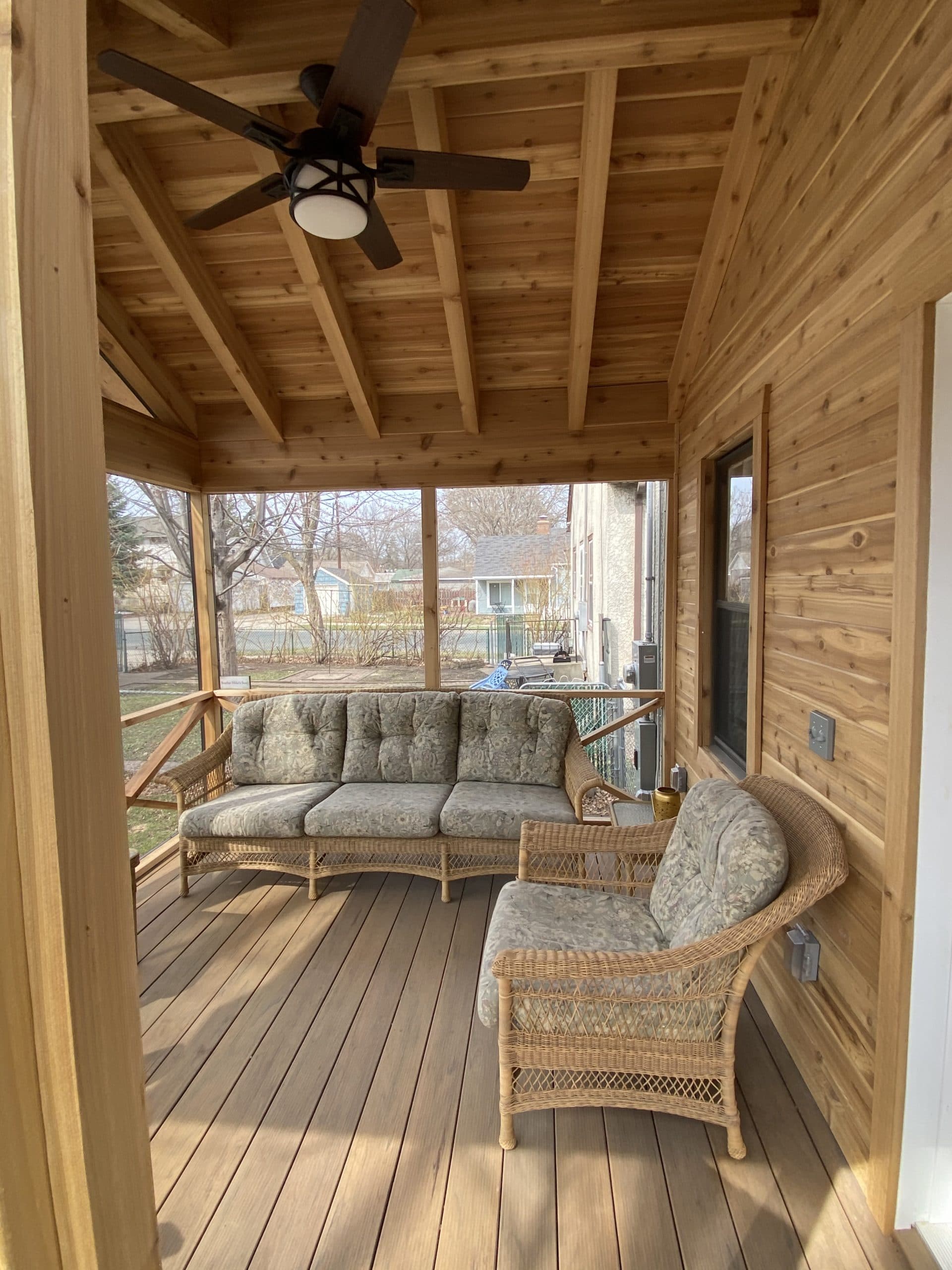 interior of an all wood screened in porch